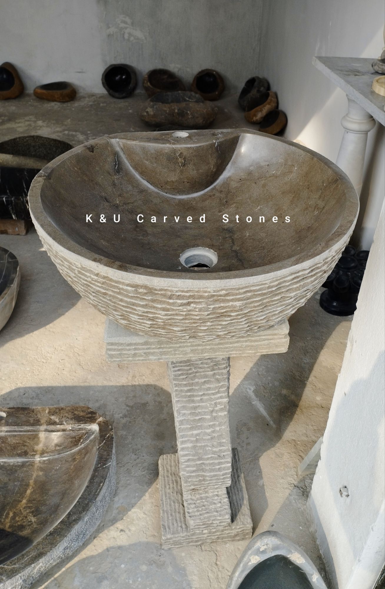 Custom natural stone pedestal sink for contemporary bathroom spaces